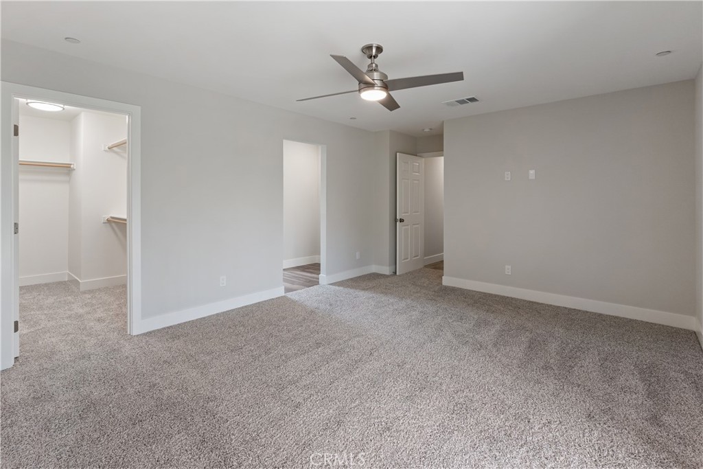 6018 William Street Riverside, CA 92504 - Photo 19 of 59 an empty room with a ceiling fan and a window