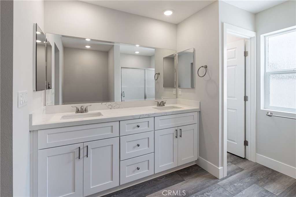 6018 William Street Riverside, CA 92504 - Photo 20 of 59 a bathroom with double sink and a mirror
