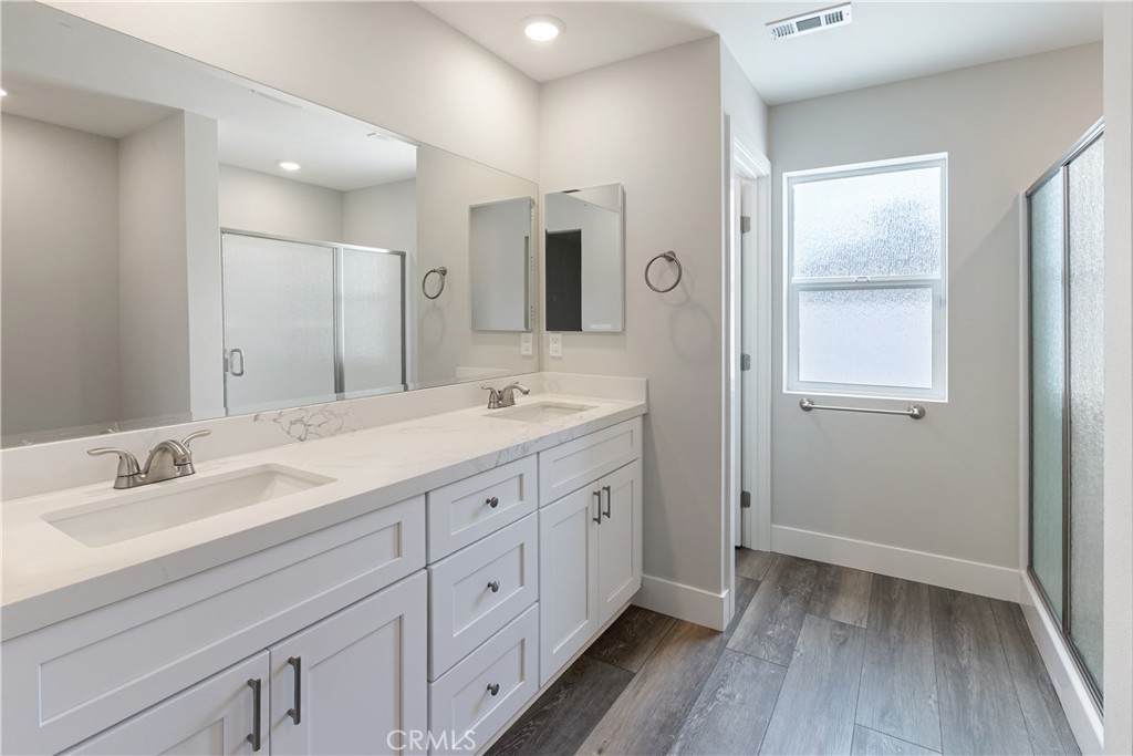6018 William Street Riverside, CA 92504 - Photo 21 of 59 a bathroom with double vanity sink and two mirror