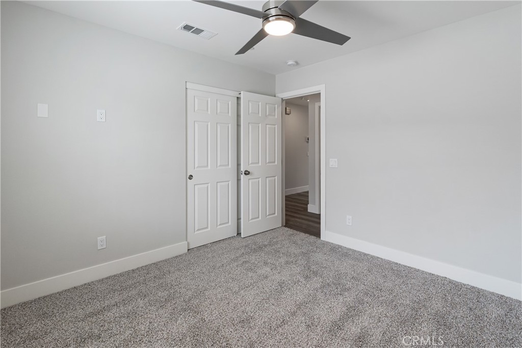 6018 William Street Riverside, CA 92504 - Photo 24 of 59 an empty room with a ceiling fan and a window