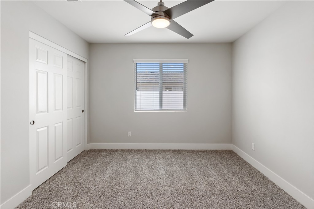 6018 William Street Riverside, CA 92504 - Photo 26 of 59 an empty room with a window and a ceiling fan