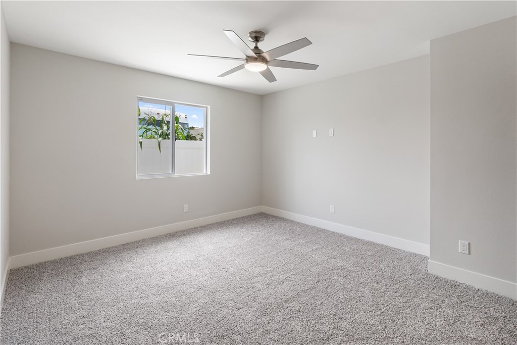 6018 William Street Riverside, CA 92504 - Photo 44 of 59 an empty room with a window and a ceiling fan