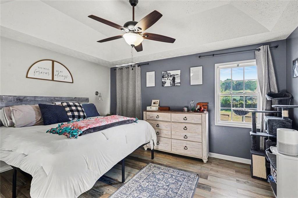 302 Fairview Lane Dallas, GA 30157 - Photo 12 of 26 a bedroom with a bed and a chandelier