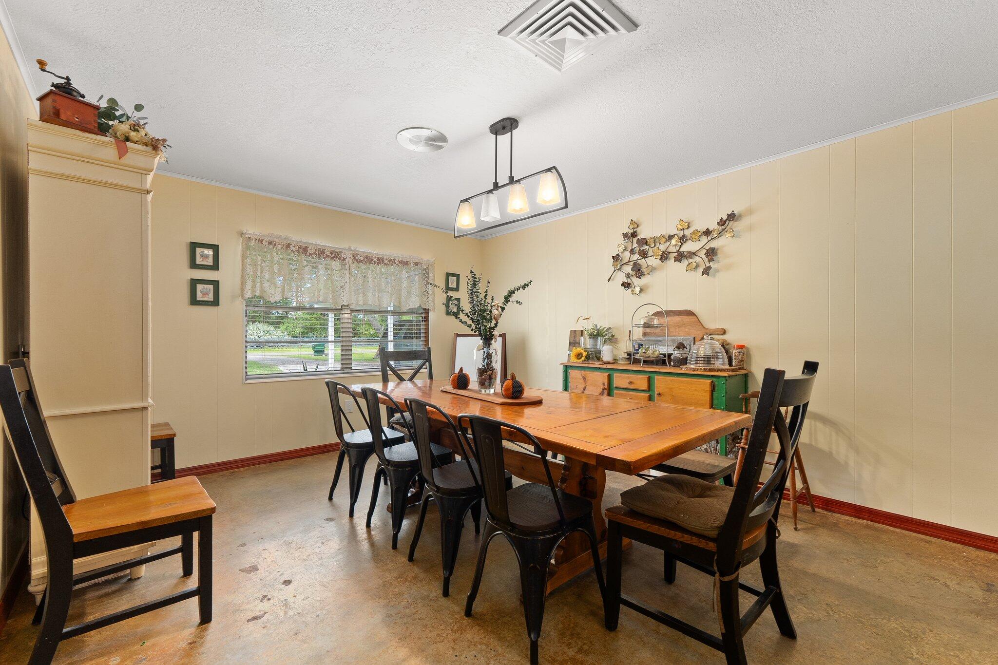 340 North Ffa Road Fort Pierce, FL 34945 - Photo 12 of 72 a dining room with furniture and window