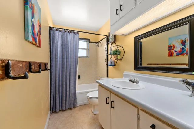 a room with a window and a chair