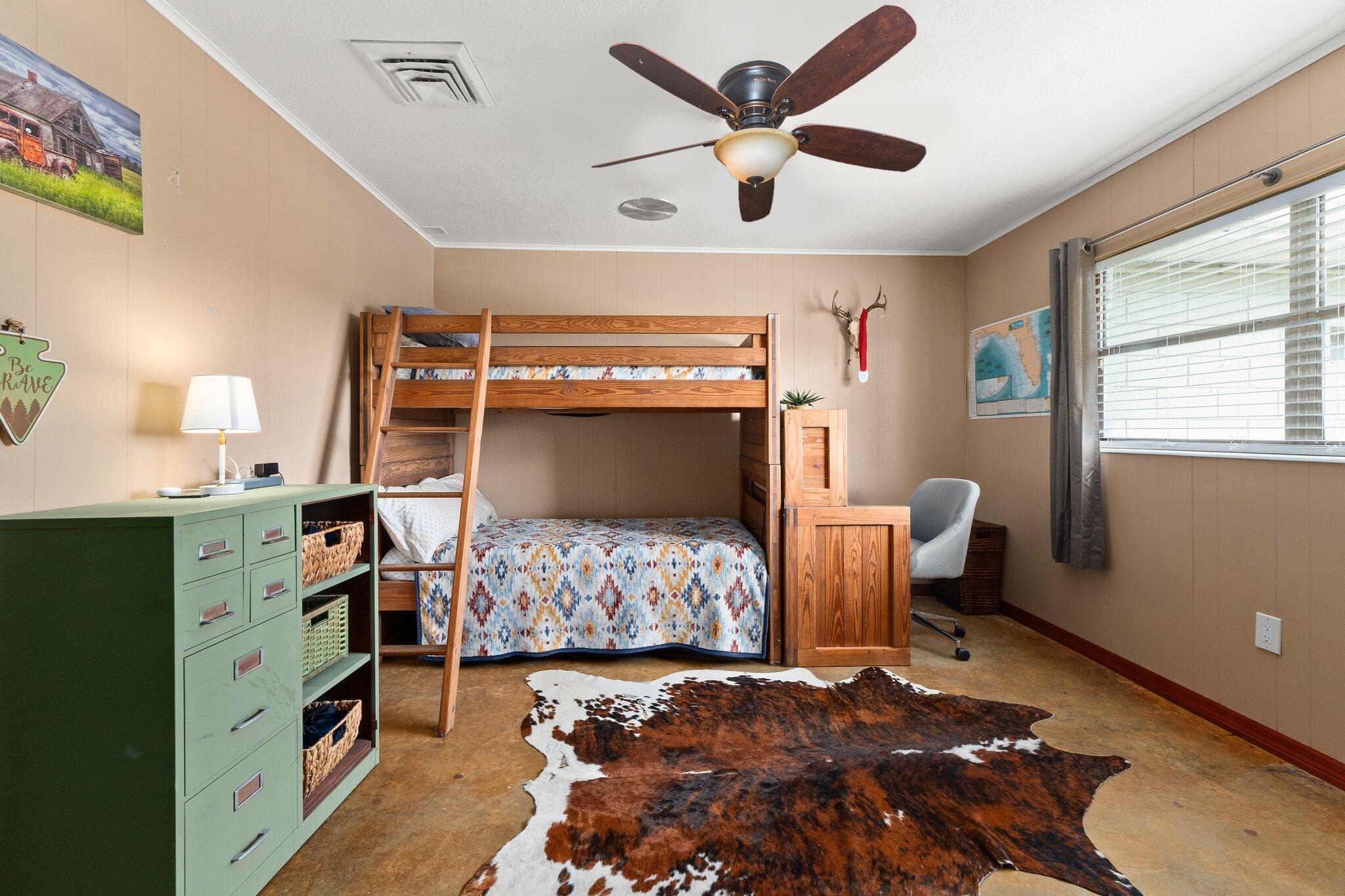 340 North Ffa Road Fort Pierce, FL 34945 - Photo 28 of 72 a bedroom with a bed and a tv