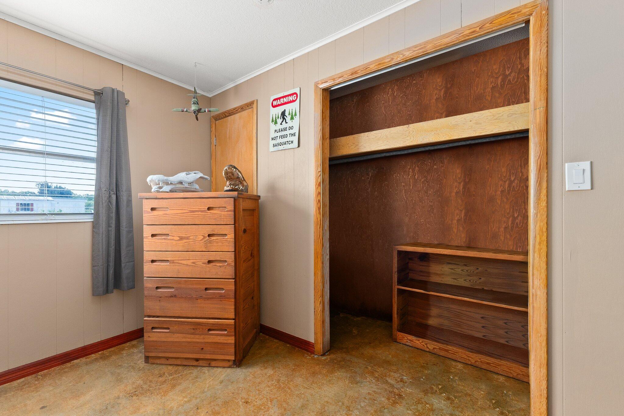 340 North Ffa Road Fort Pierce, FL 34945 - Photo 30 of 72 a view of walk in closet with clothes