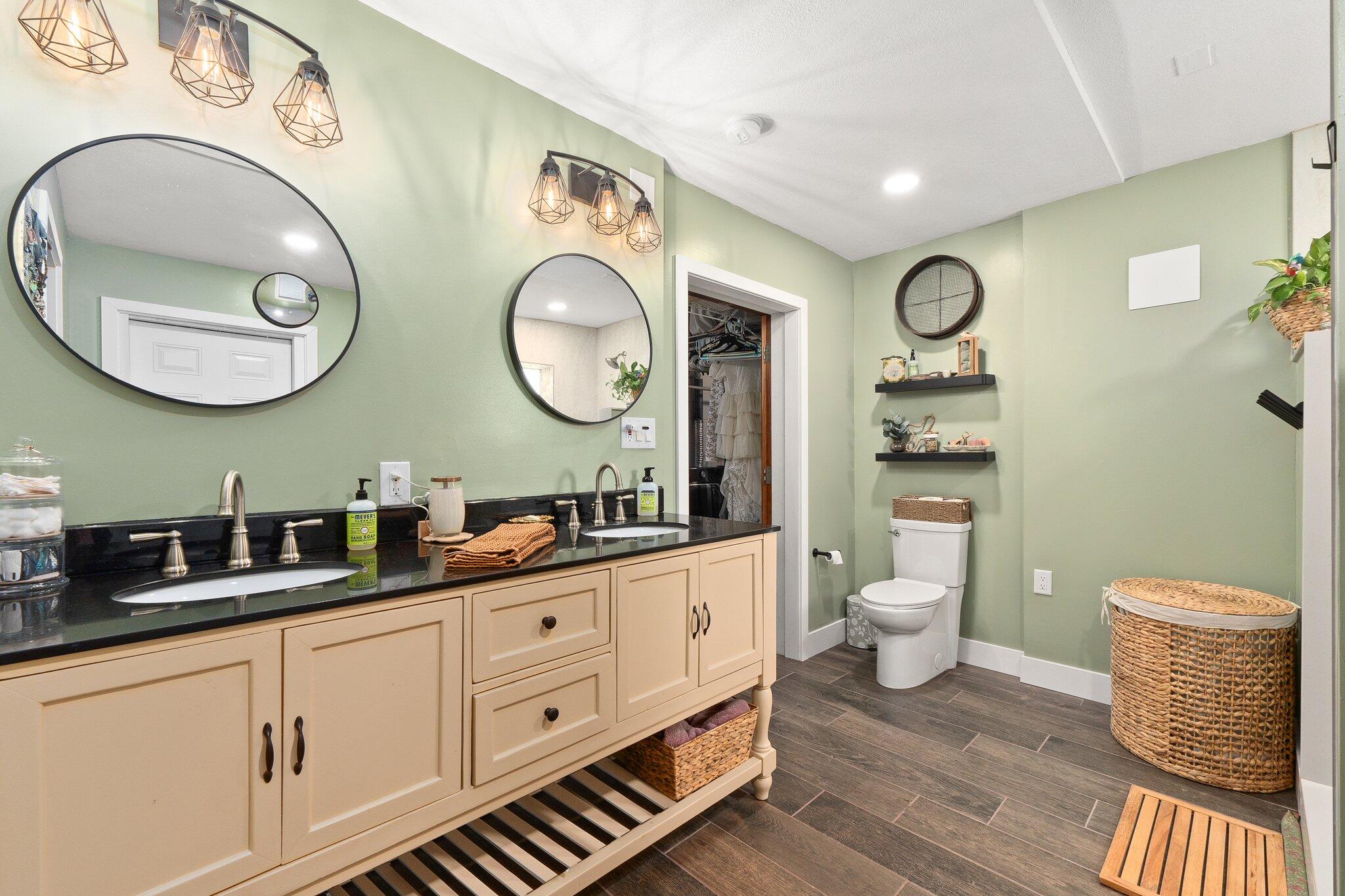 340 North Ffa Road Fort Pierce, FL 34945 - Photo 37 of 72 a bathroom with a toilet a sink and a mirror