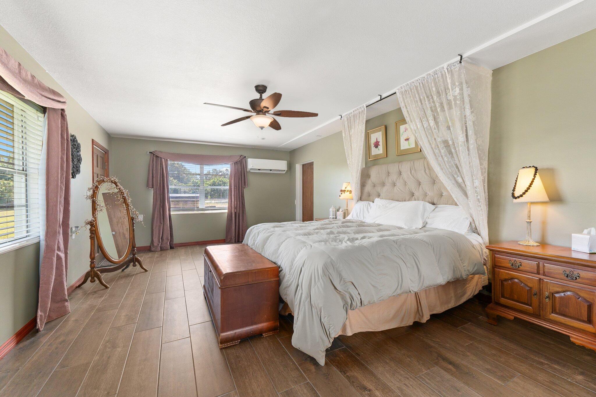 340 North Ffa Road Fort Pierce, FL 34945 - Photo 39 of 72 a bedroom with a bed a mirror on dresser and a window