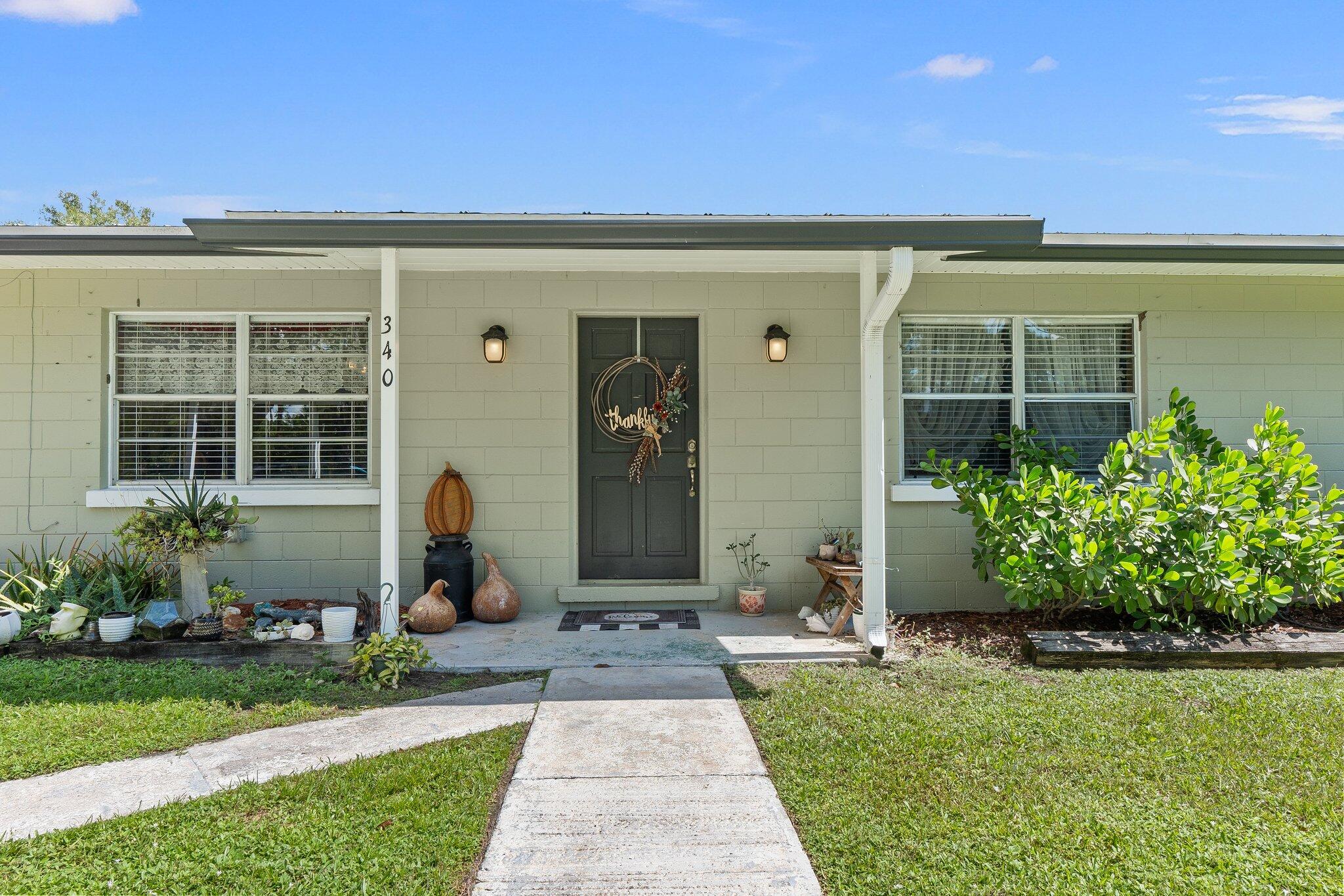 340 North Ffa Road Fort Pierce, FL 34945 - Photo 4 of 72 a front view of a house with garden