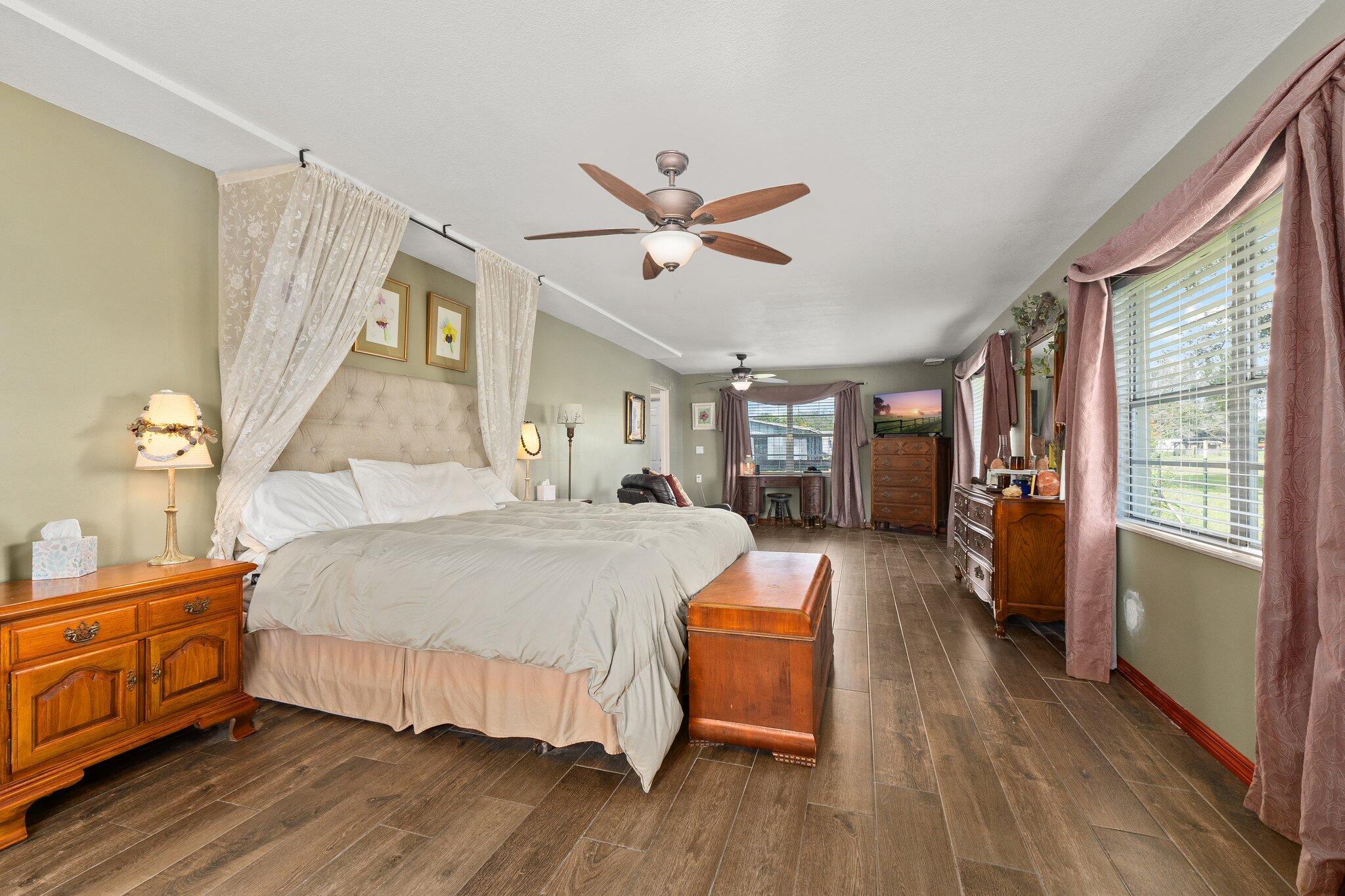 340 North Ffa Road Fort Pierce, FL 34945 - Photo 41 of 72 a bedroom with a bed and a chandelier