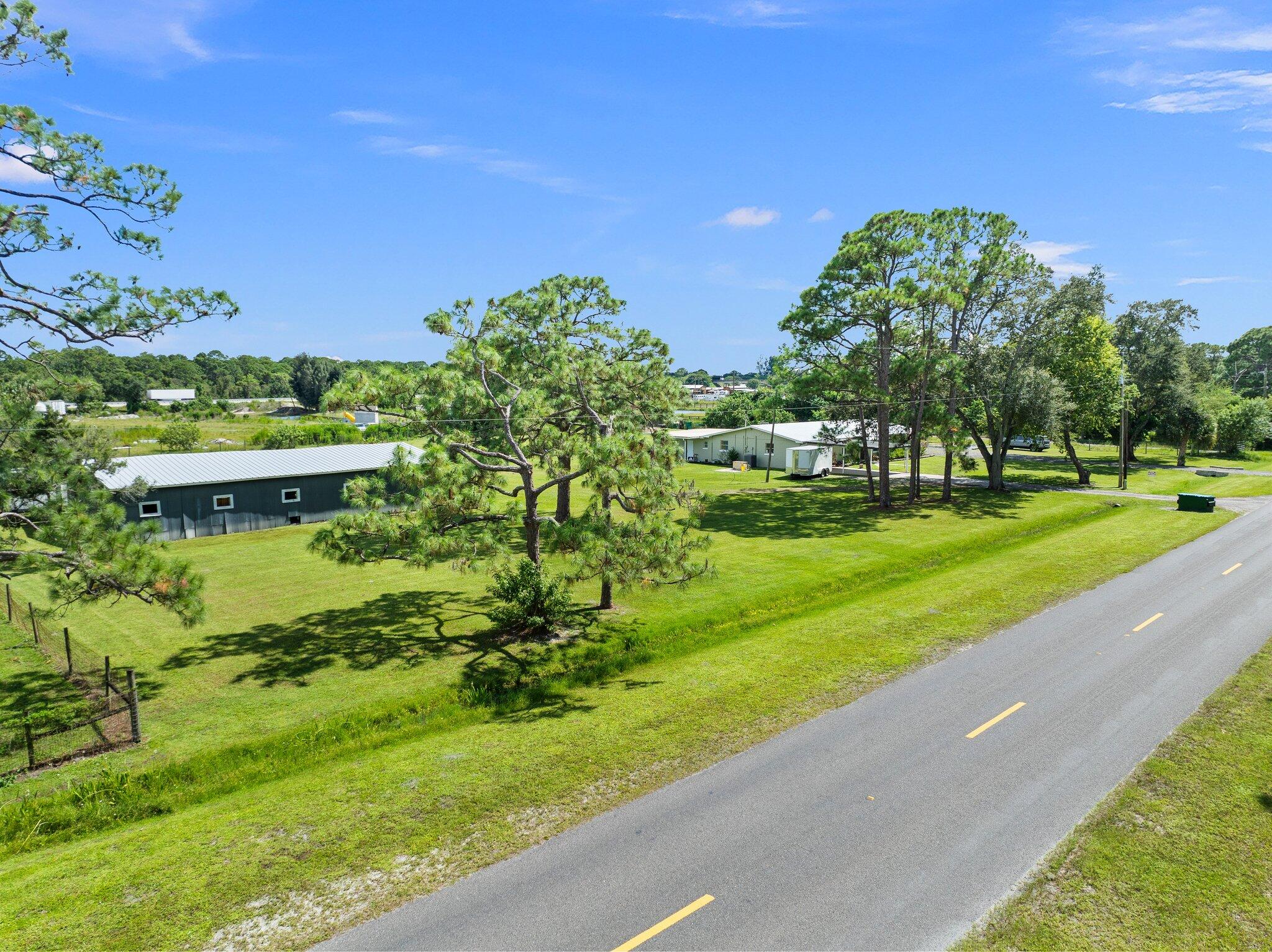340 North Ffa Road Fort Pierce, FL 34945 - Photo 48 of 72 a view of a garden with a building in the background