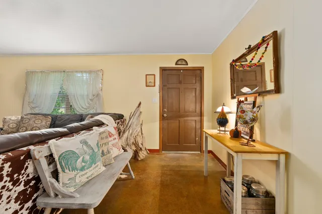 a living room with furniture and a table