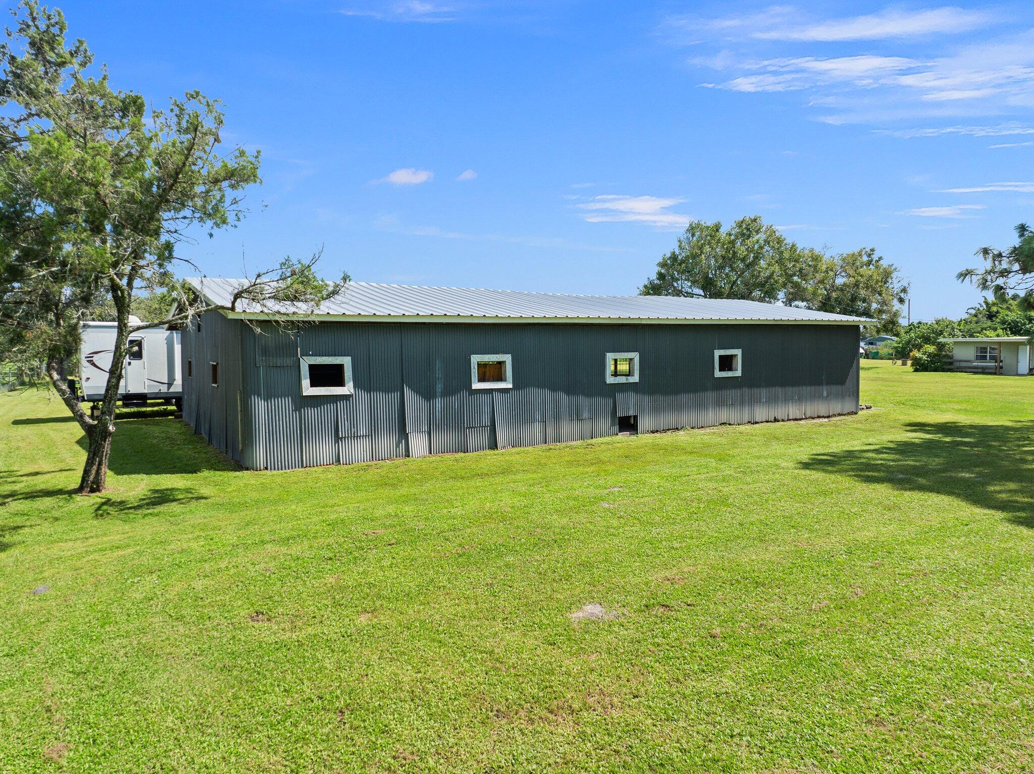 340 North Ffa Road Fort Pierce, FL 34945 - Photo 57 of 72 a front view of a house with a garden