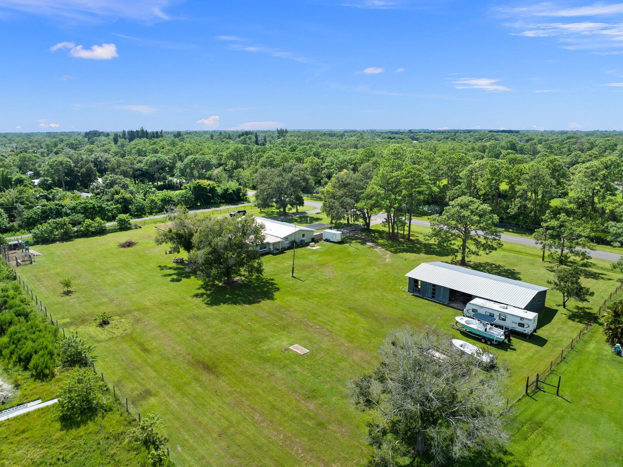 340 North Ffa Road Fort Pierce, FL 34945 - Photo 58 of 72 a view of a garden with a building in the background