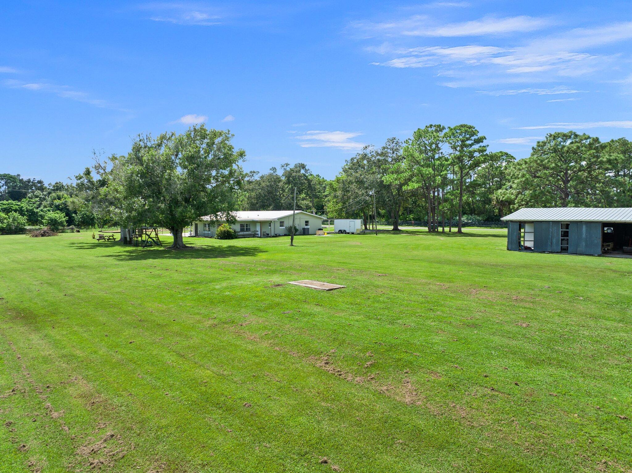 340 North Ffa Road Fort Pierce, FL 34945 - Photo 59 of 72 a view of a house with a big yard
