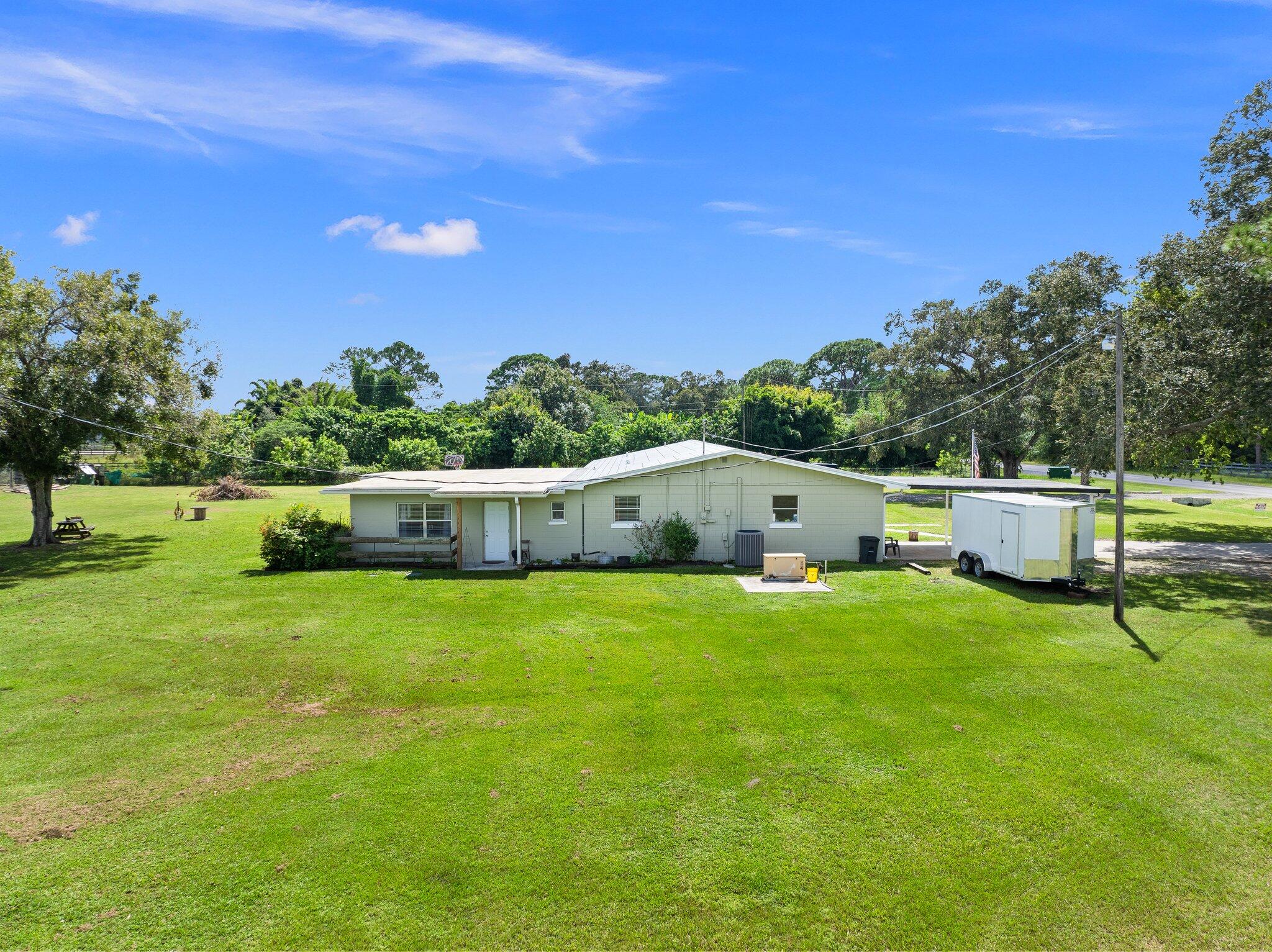 340 North Ffa Road Fort Pierce, FL 34945 - Photo 60 of 72 a house view with a garden space