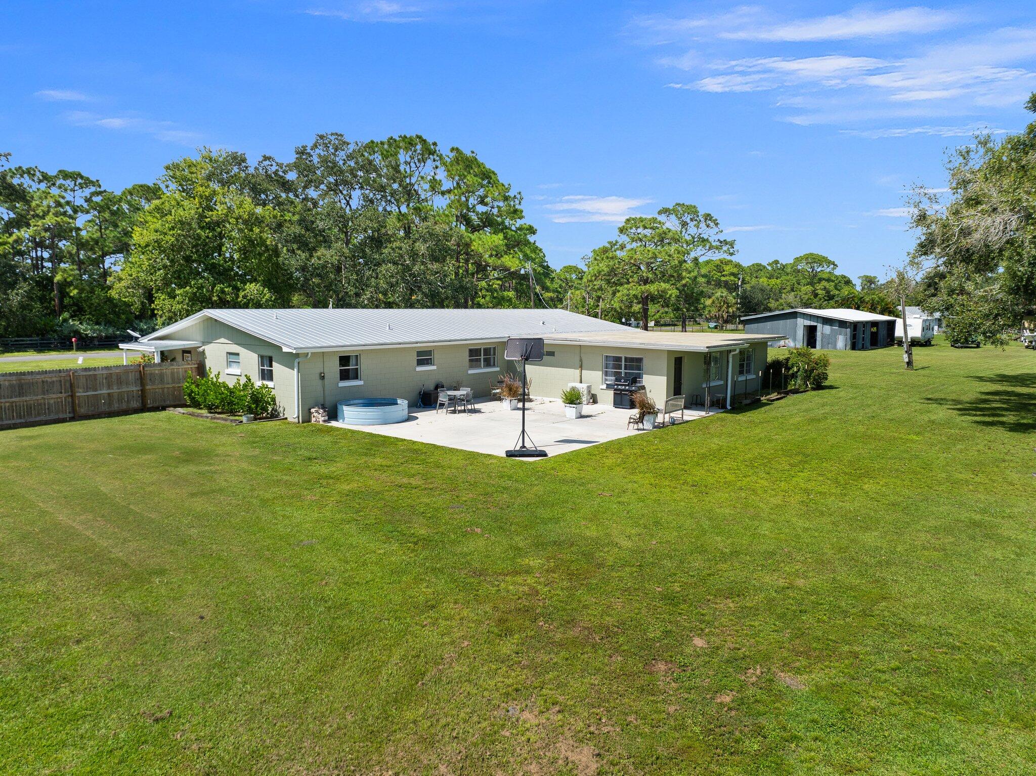 340 North Ffa Road Fort Pierce, FL 34945 - Photo 61 of 72 a view of house with swimming pool yard and outdoor seating