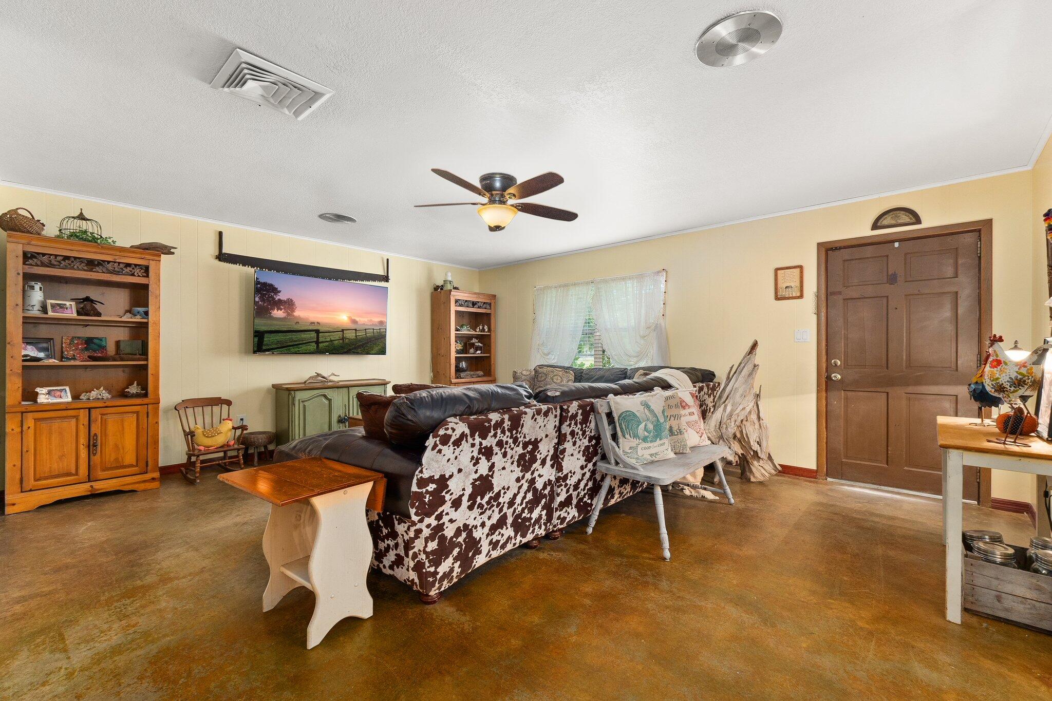 340 North Ffa Road Fort Pierce, FL 34945 - Photo 8 of 72 a living room with furniture and a flat screen tv