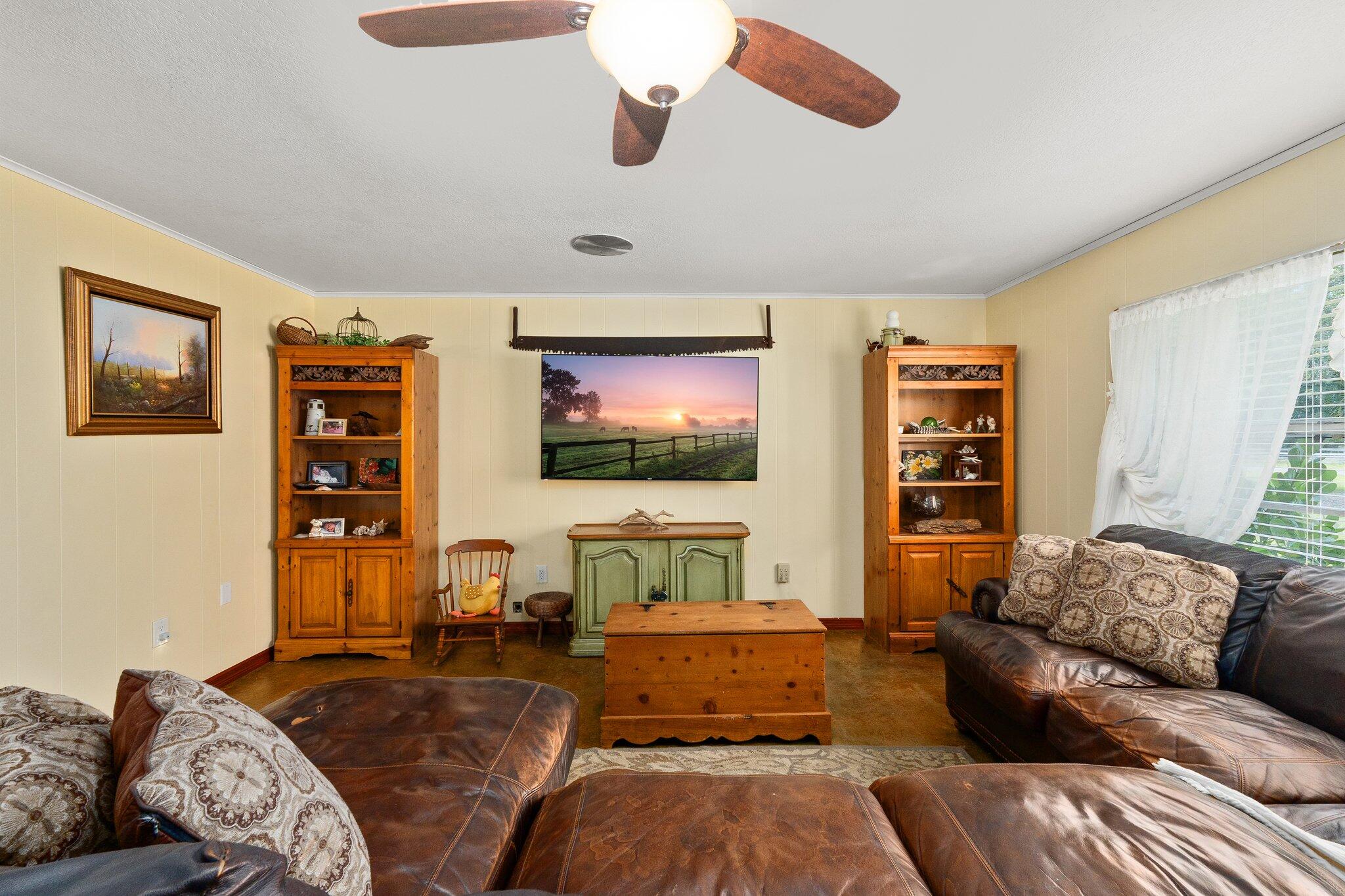 340 North Ffa Road Fort Pierce, FL 34945 - Photo 9 of 72 a living room with furniture and a flat screen tv