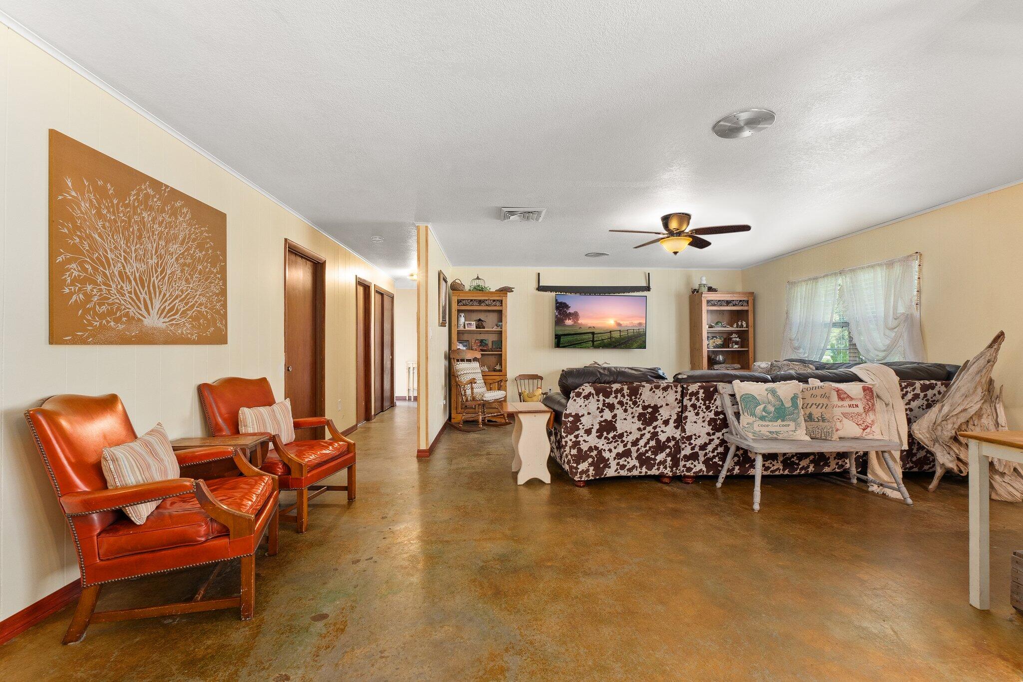 340 North Ffa Road Fort Pierce, FL 34945 - Photo 10 of 72 a living room with furniture and a flat screen tv
