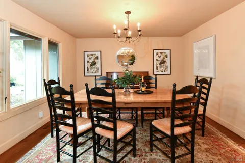 a large kitchen with stainless steel appliances granite countertop a sink and a stove