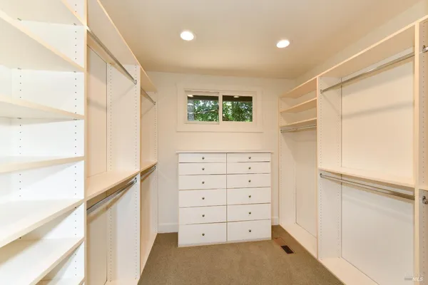a bathroom with double vanity sinks and a mirror