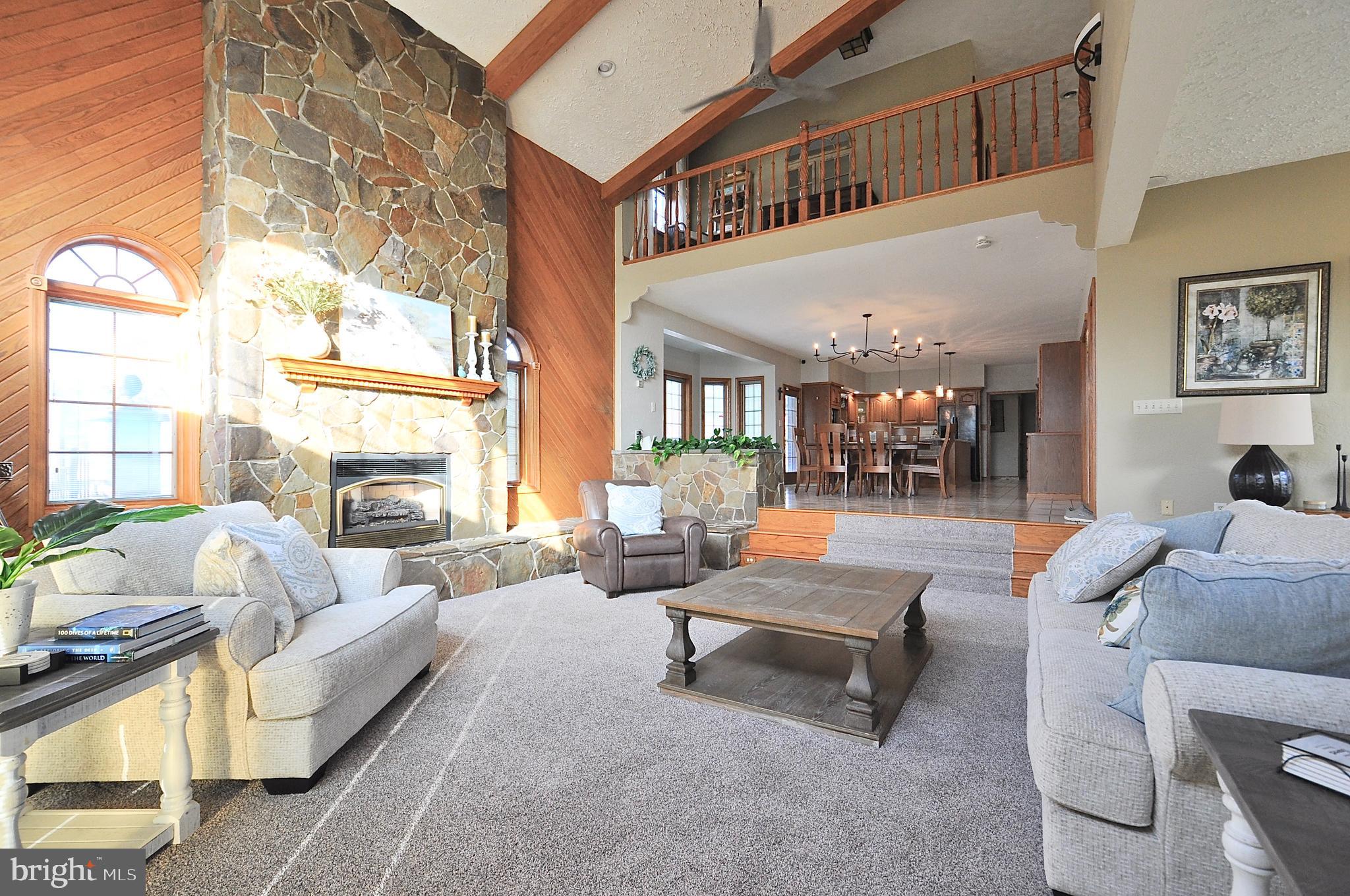 13370 South Eagle Valley Road Tyrone, PA 16686 - Photo 12 of 43 a living room with furniture and a fireplace