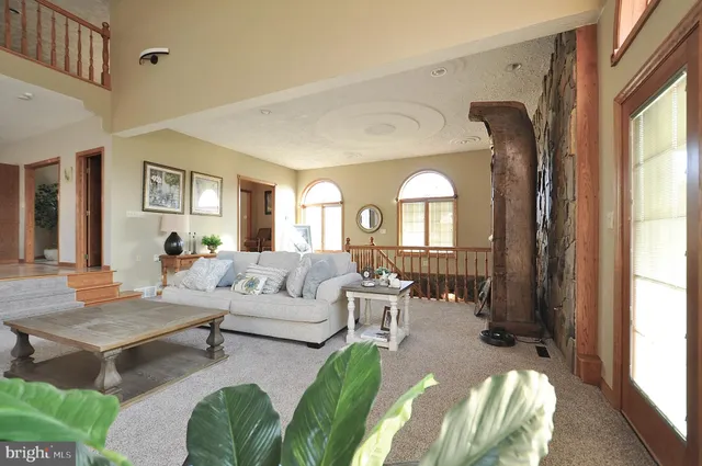 a living room with furniture and windows