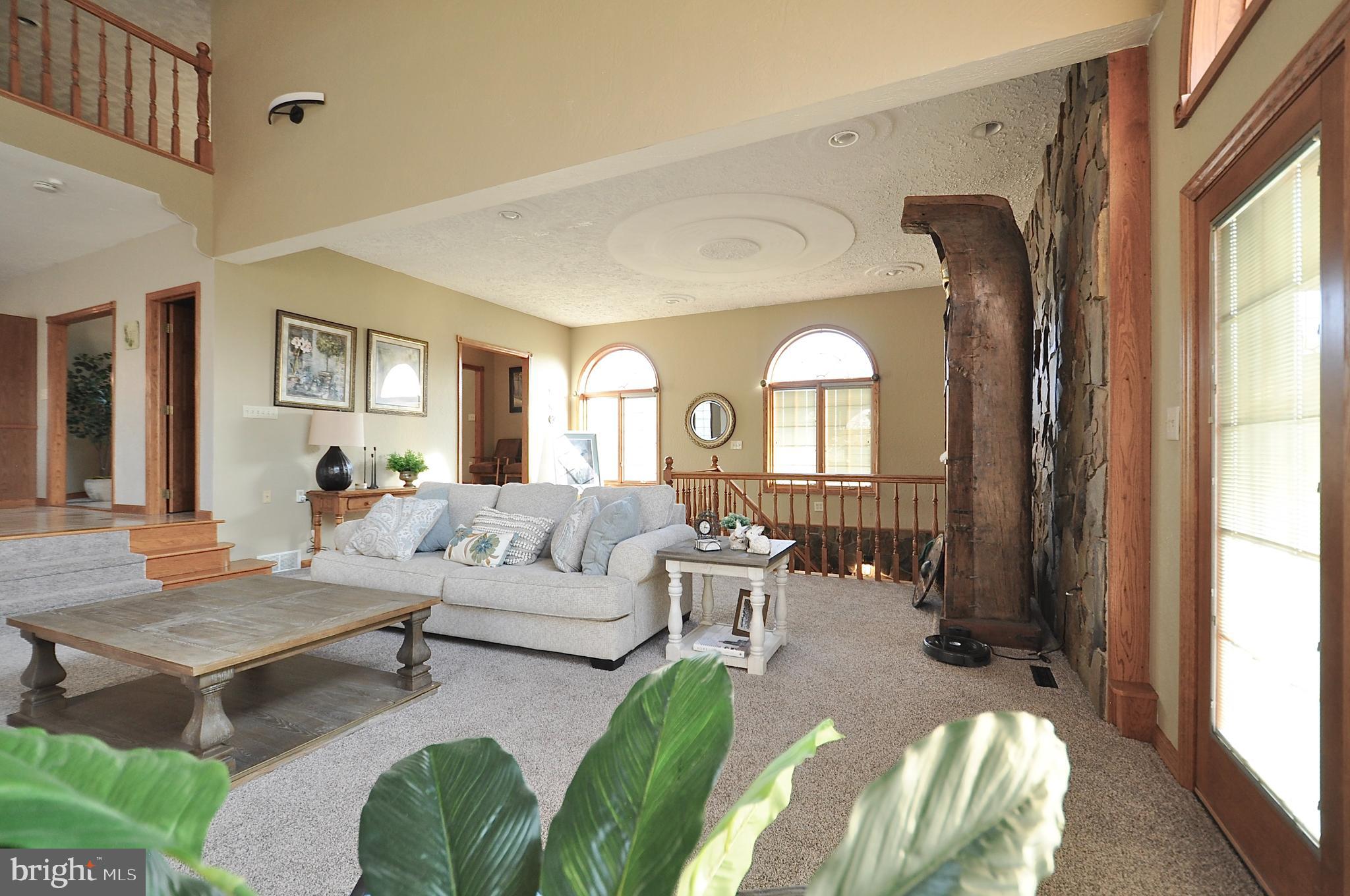 13370 South Eagle Valley Road Tyrone, PA 16686 - Photo 14 of 43 a living room with furniture fireplace and a large window