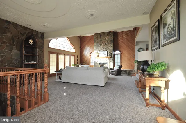 a view of a livingroom with furniture and a window