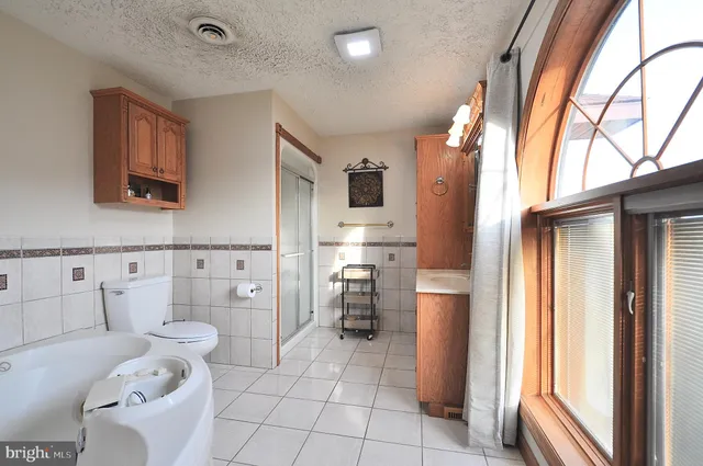 a view of a livingroom with furniture and hardwood floor