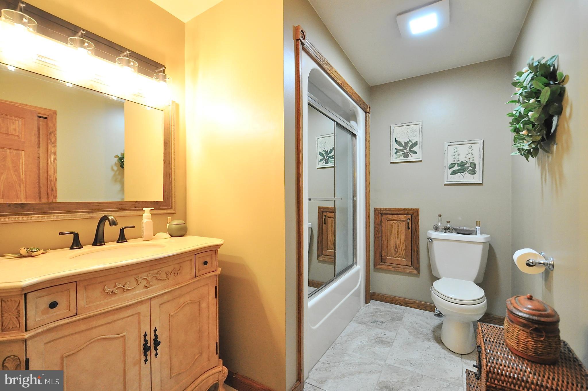 13370 South Eagle Valley Road Tyrone, PA 16686 - Photo 31 of 43 a bathroom with a sink a toilet and shower