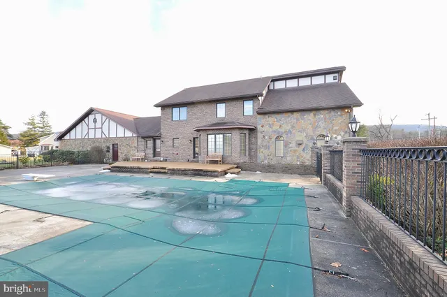 a view of a yard with large trees