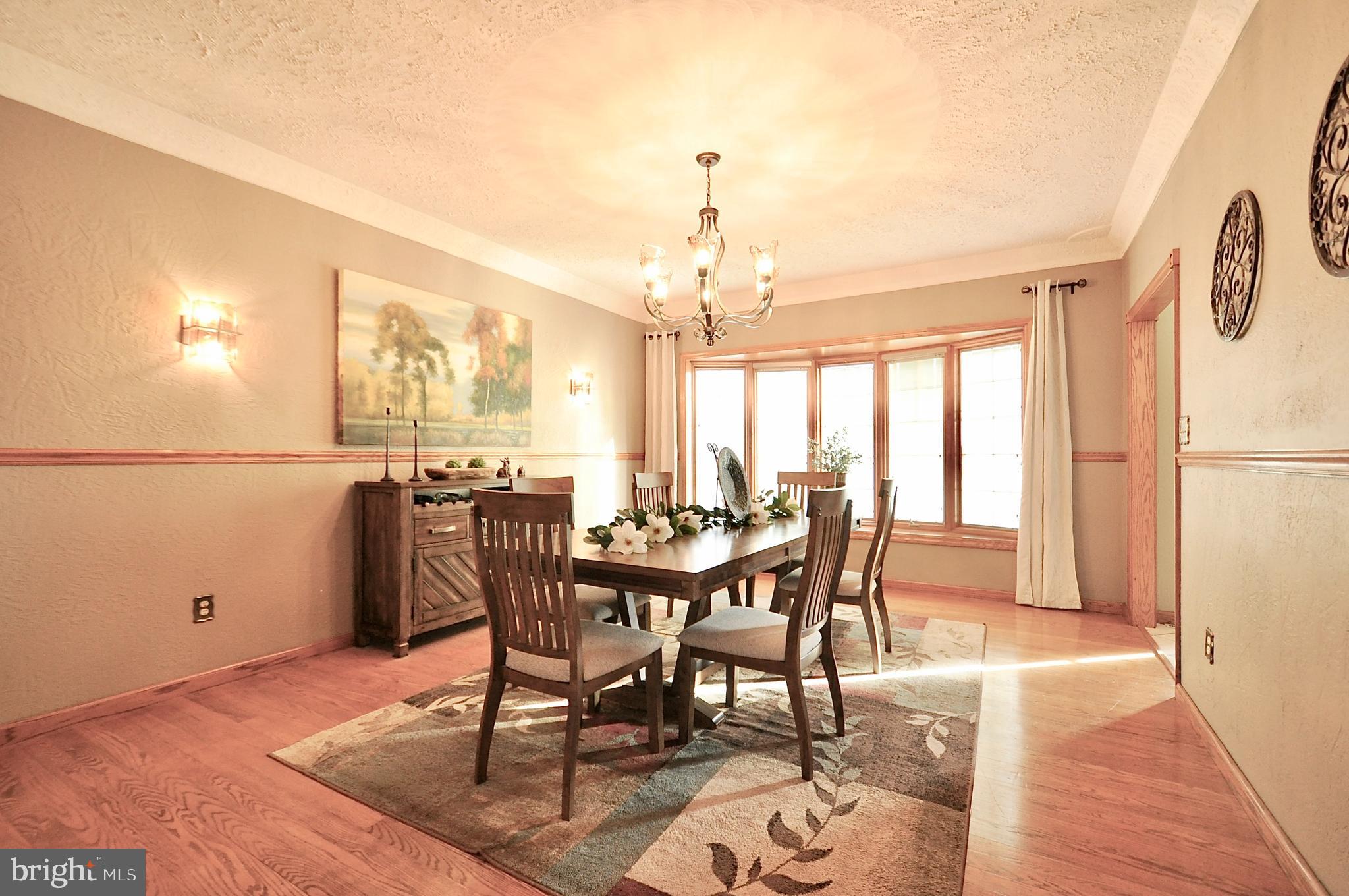 13370 South Eagle Valley Road Tyrone, PA 16686 - Photo 6 of 43 a view of a dining room with furniture and a chandelier