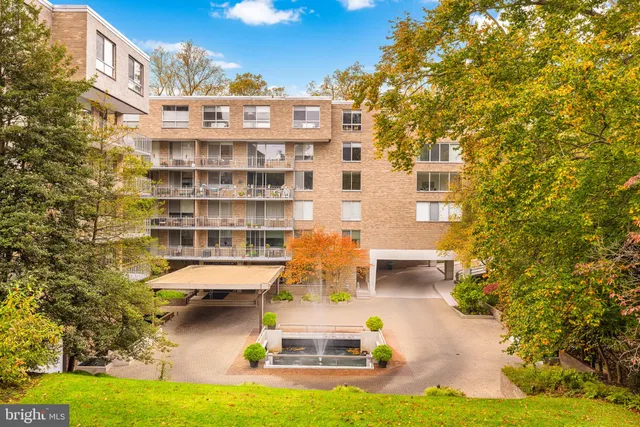 a front view of a building with swimming pool