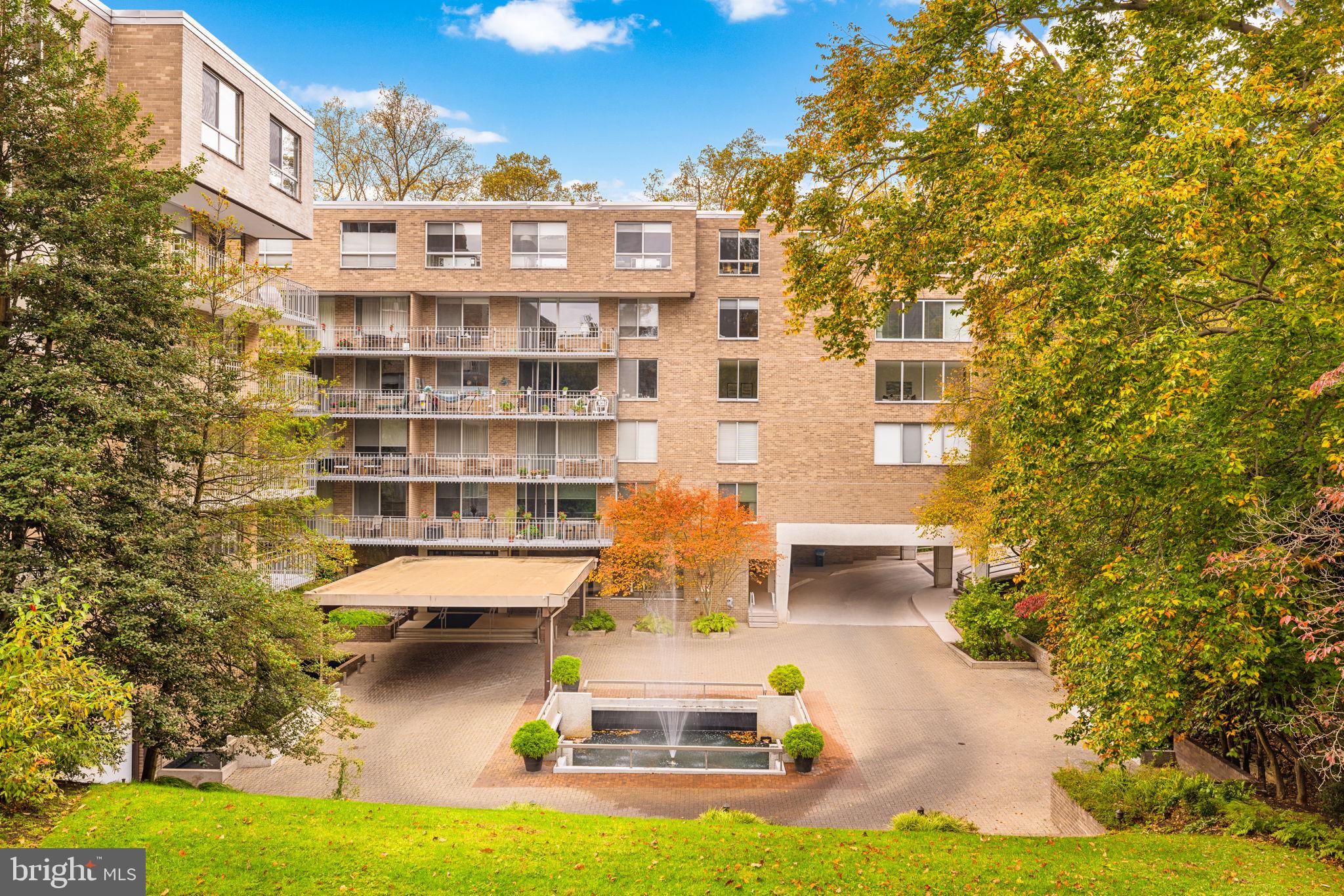 a front view of a building with swimming pool