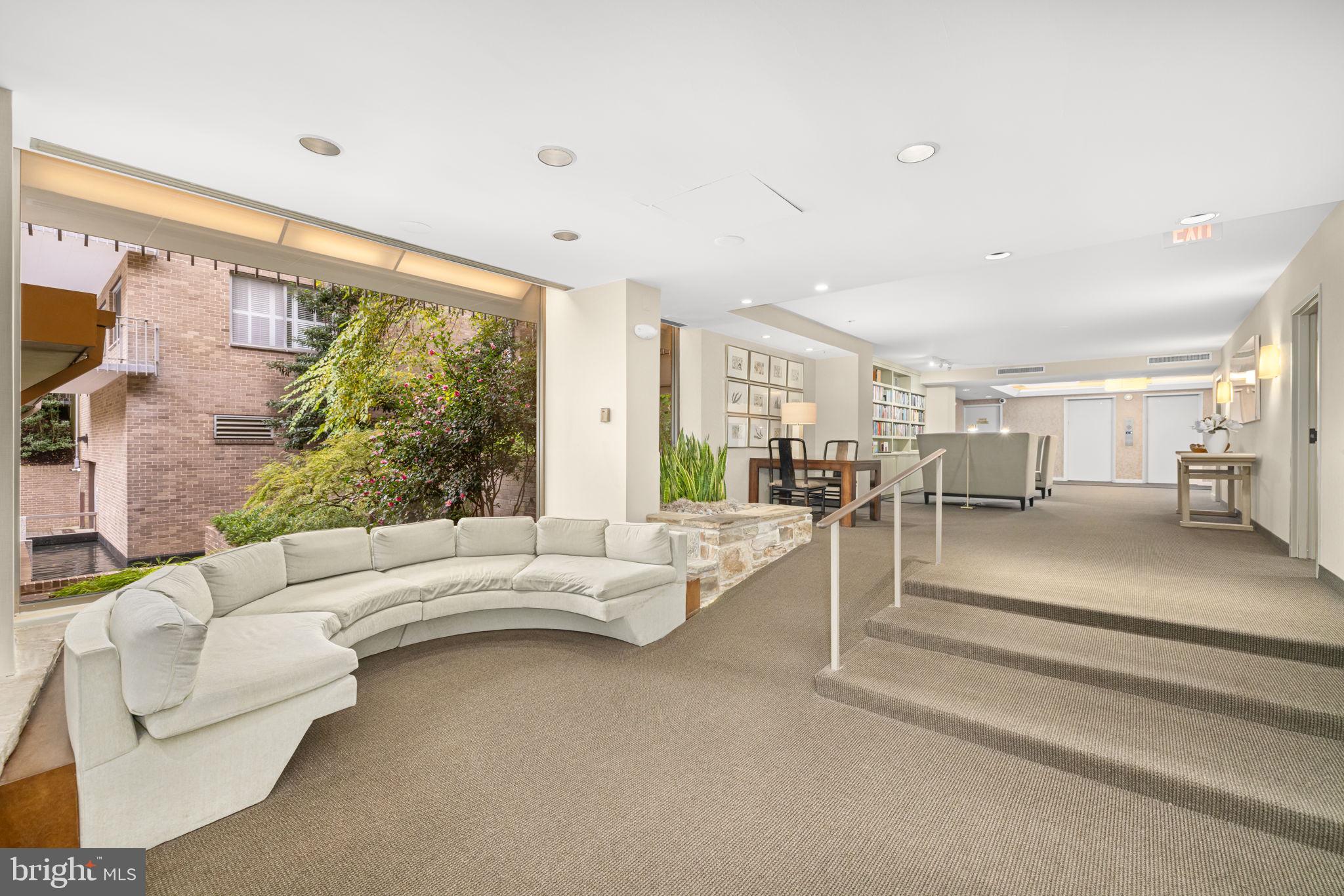 4100 Cathedral Avenue Northwest, Unit 712 Washington, DC 20016 - Photo 16 of 24 a living room with furniture and a large window