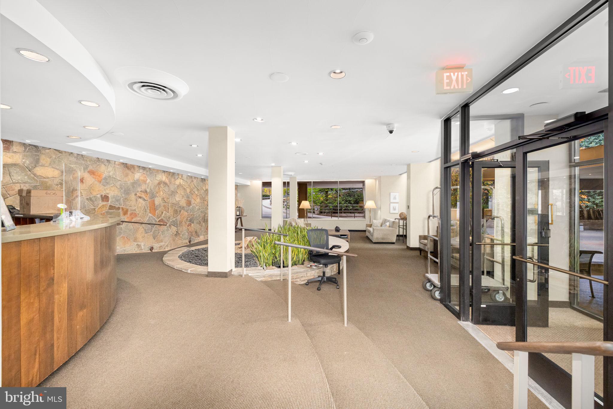 4100 Cathedral Avenue Northwest, Unit 712 Washington, DC 20016 - Photo 17 of 24 a living room with furniture a large window and flat screen tv