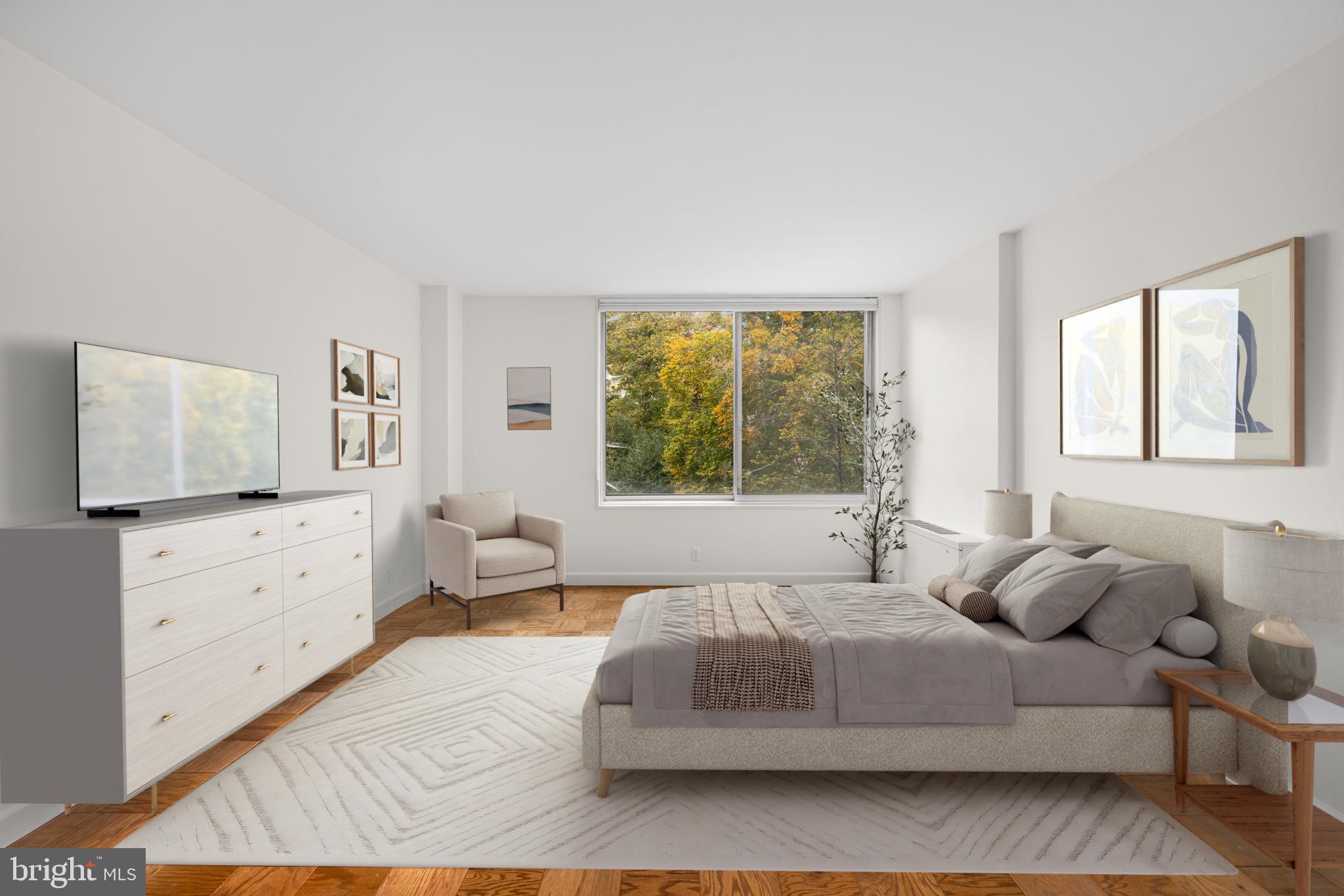 4100 Cathedral Avenue Northwest, Unit 712 Washington, DC 20016 - Photo 8 of 24 a spacious bedroom with a large bed and a dresser