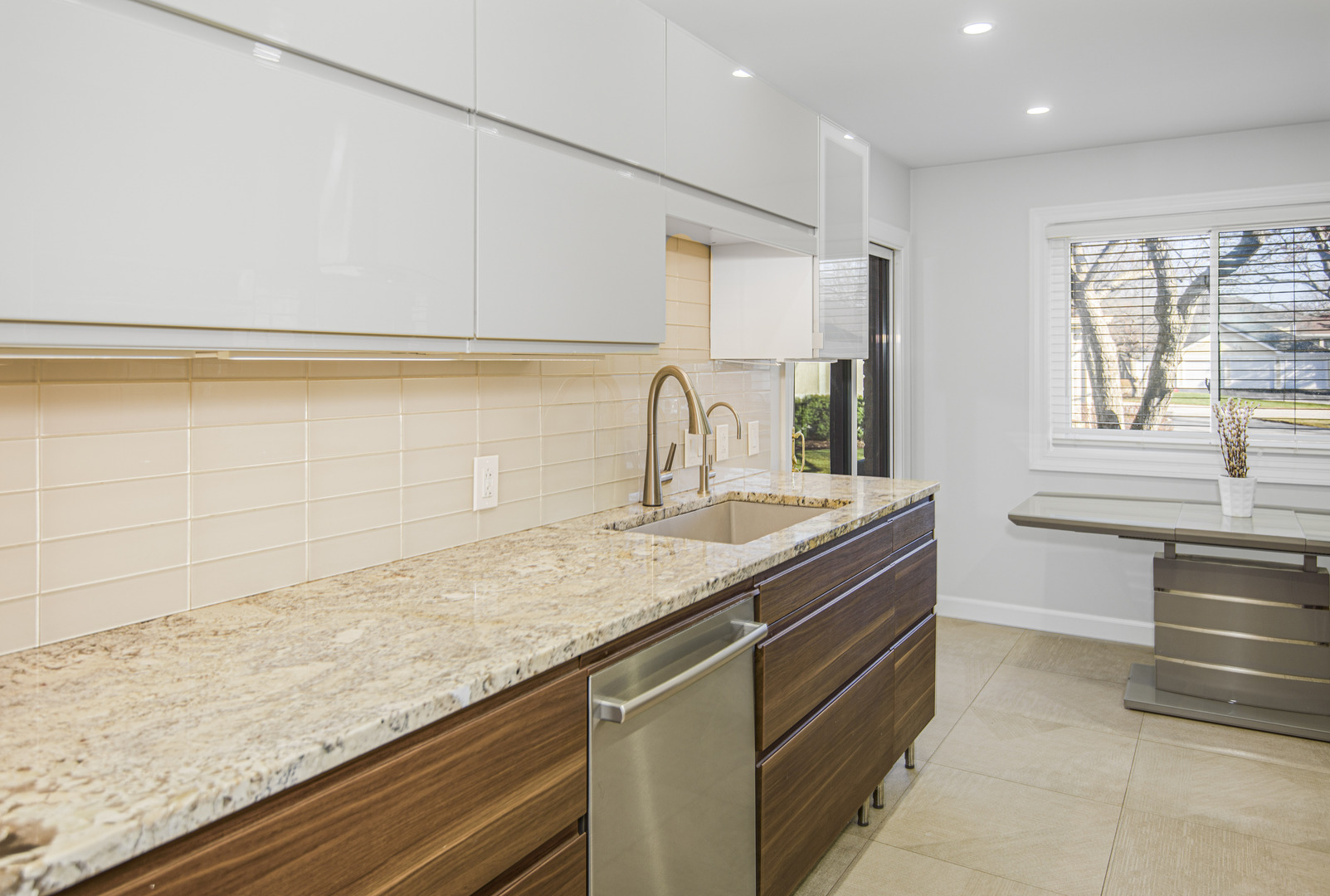 1168 Middlebury Lane, Unit A1 Wheeling, IL 60090 - Photo 13 of 28 a kitchen with a sink and a wooden floor
