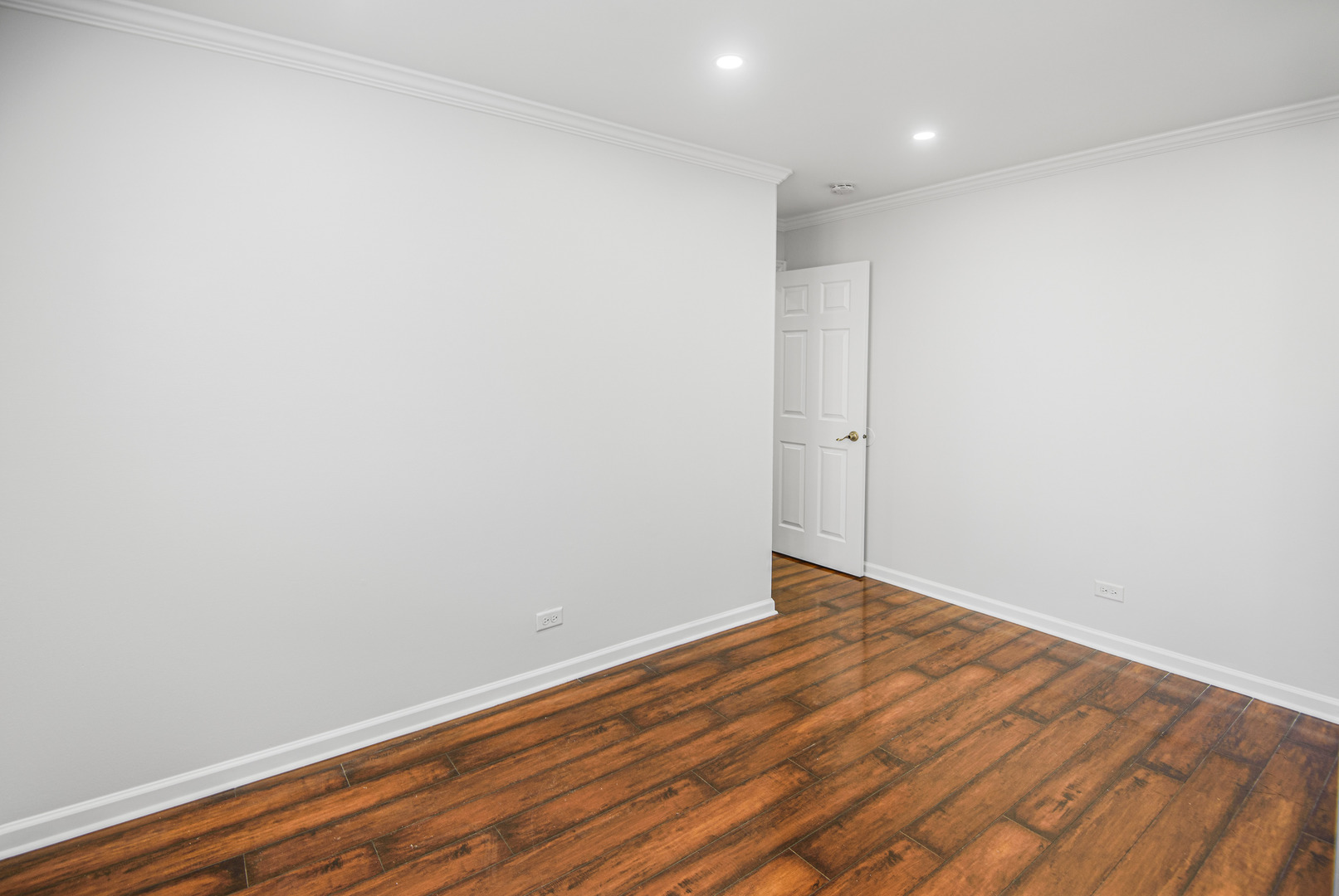 1168 Middlebury Lane, Unit A1 Wheeling, IL 60090 - Photo 17 of 28 a view of an empty room with wooden floor
