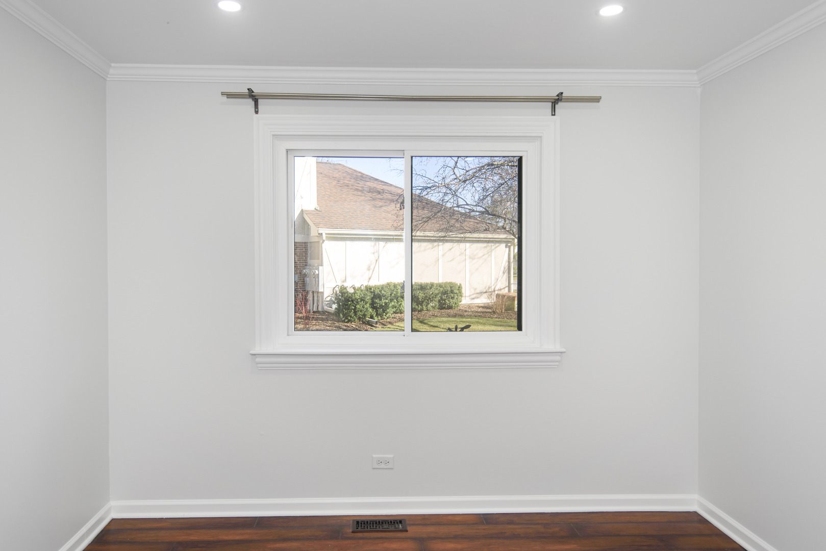 1168 Middlebury Lane, Unit A1 Wheeling, IL 60090 - Photo 20 of 28 a view of a small space with wooden floor and a window