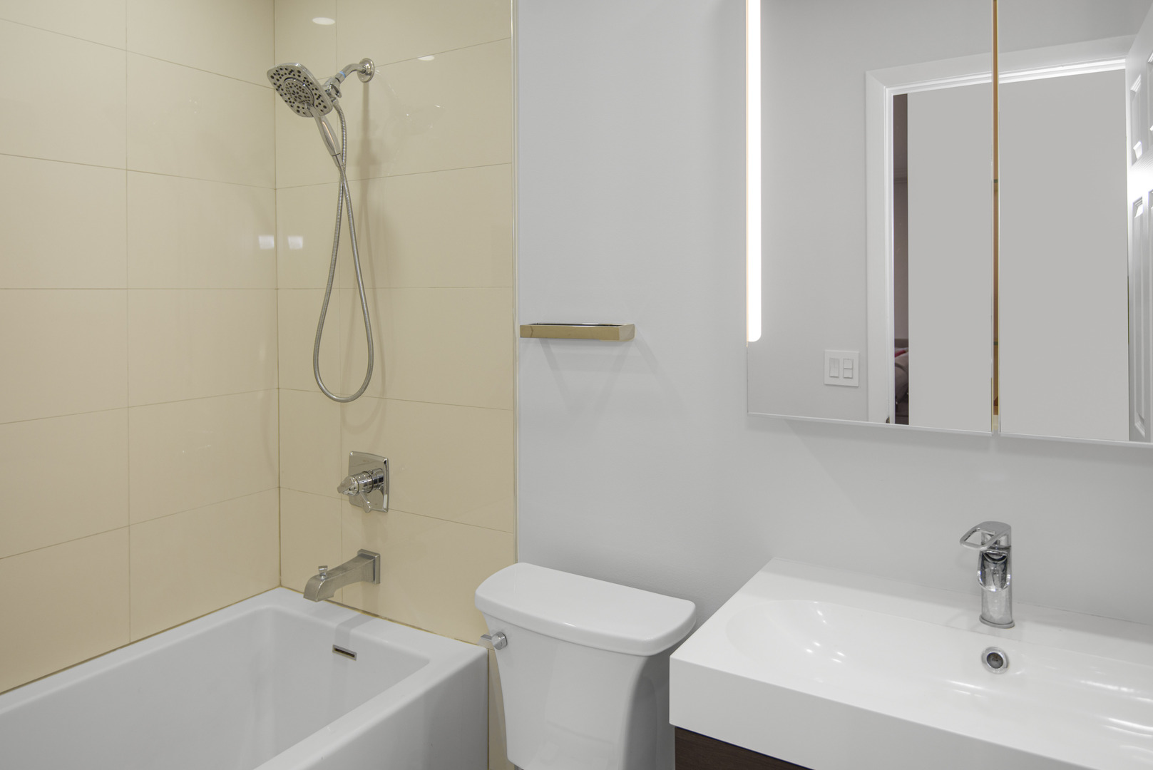 1168 Middlebury Lane, Unit A1 Wheeling, IL 60090 - Photo 23 of 28 a bathroom with a sink a toilet and shower