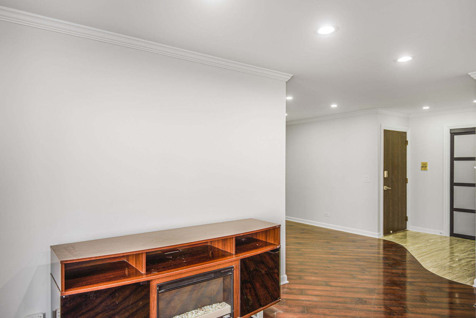1168 Middlebury Lane, Unit A1 Wheeling, IL 60090 - Photo 6 of 28 a view of room with wooden floor