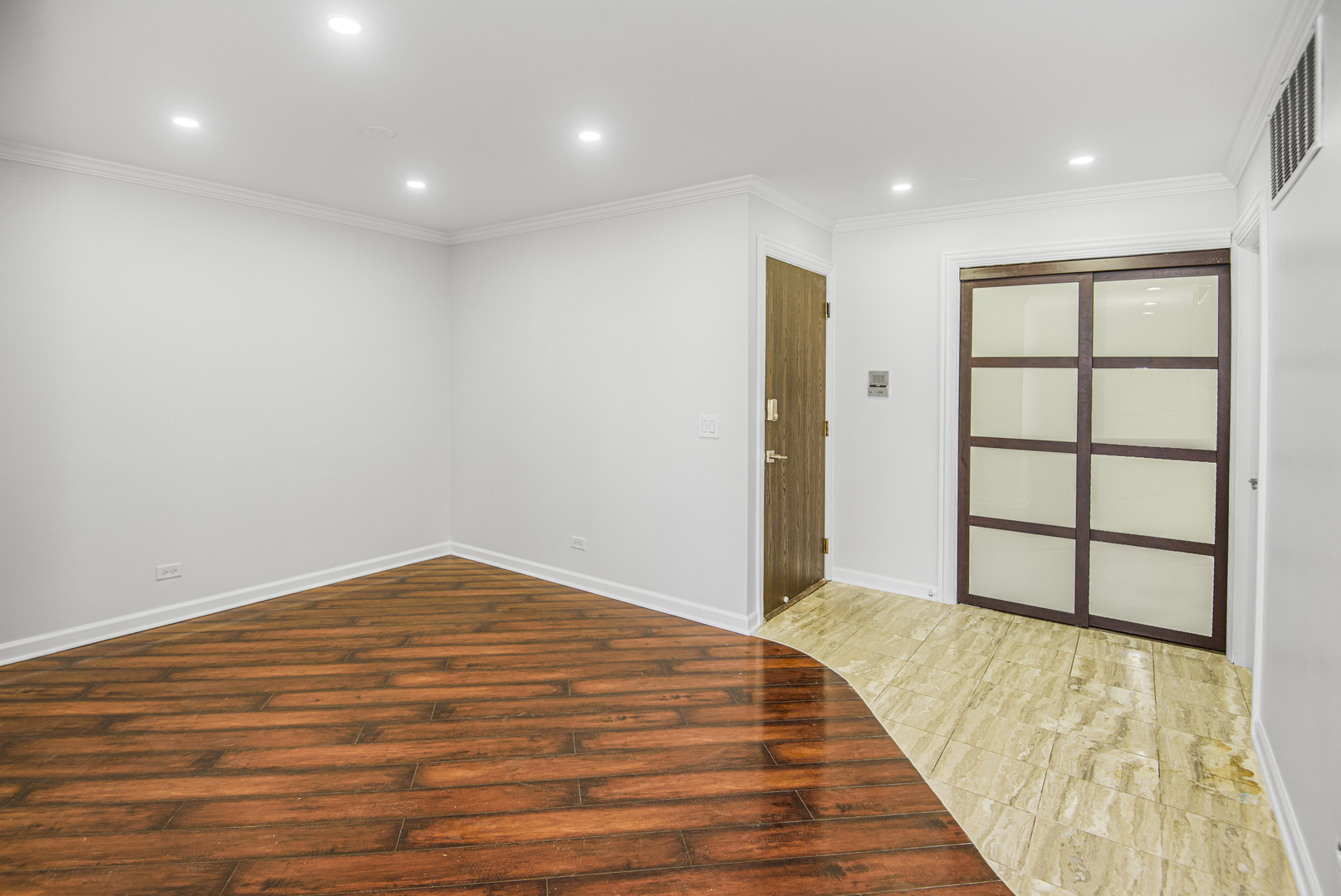1168 Middlebury Lane, Unit A1 Wheeling, IL 60090 - Photo 8 of 28 a view of empty room with wooden floor