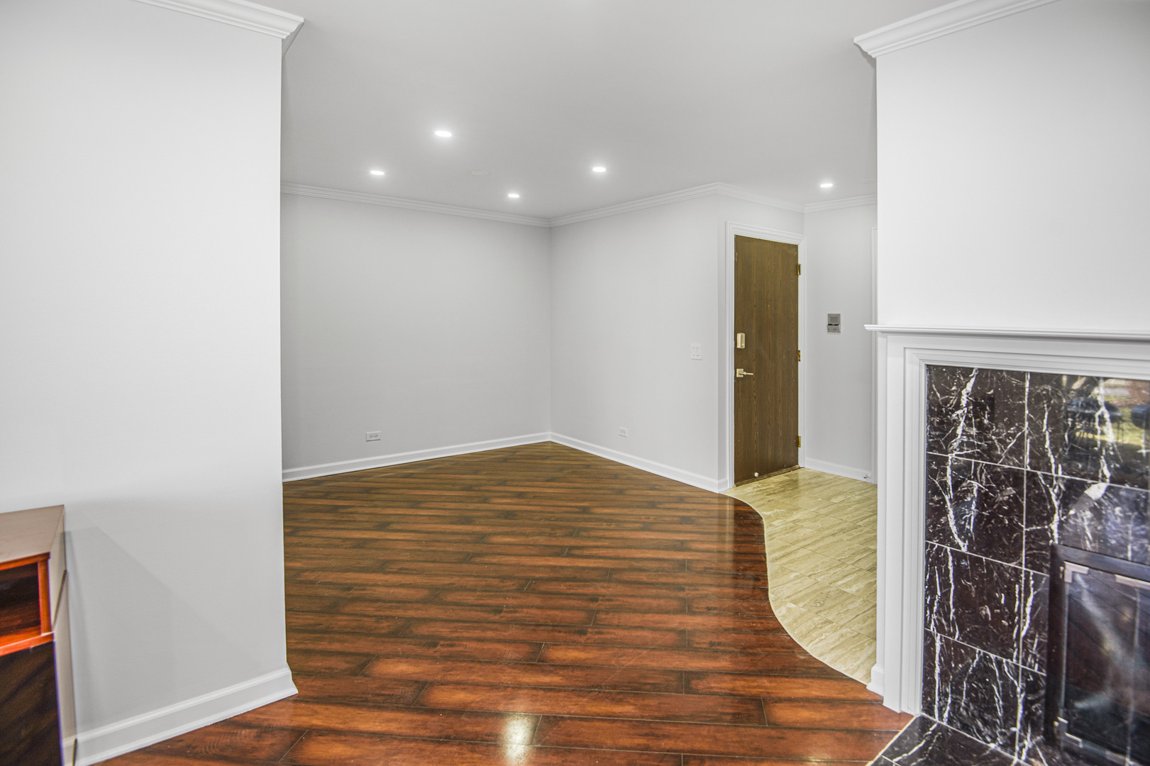 1168 Middlebury Lane, Unit A1 Wheeling, IL 60090 - Photo 9 of 28 a view of empty room with wooden floor