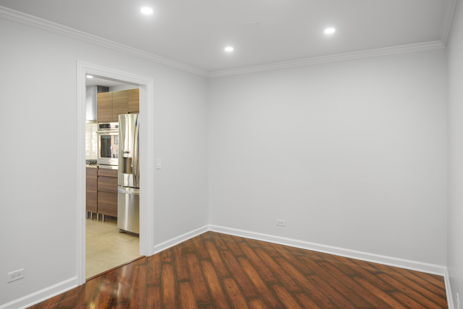 1168 Middlebury Lane, Unit A1 Wheeling, IL 60090 - Photo 10 of 28 wooden floor in a hall with an entryway