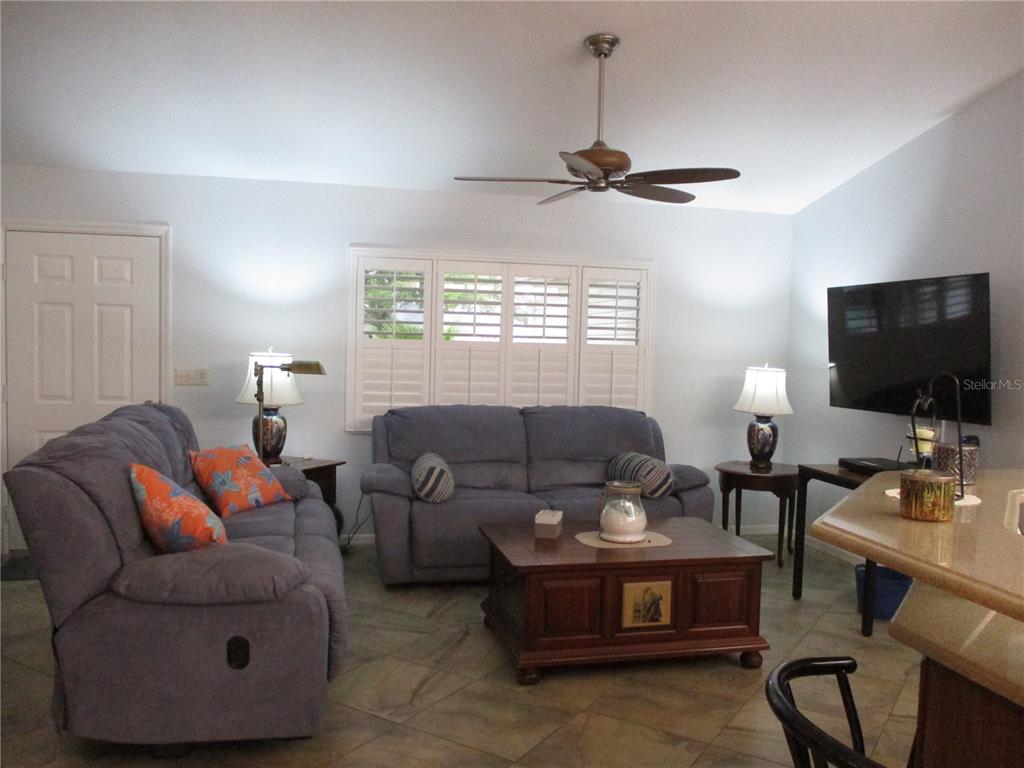 11273 Southwest 136th Place Dunnellon, FL 34432 - Photo 14 of 78 a living room with furniture and a flat screen tv