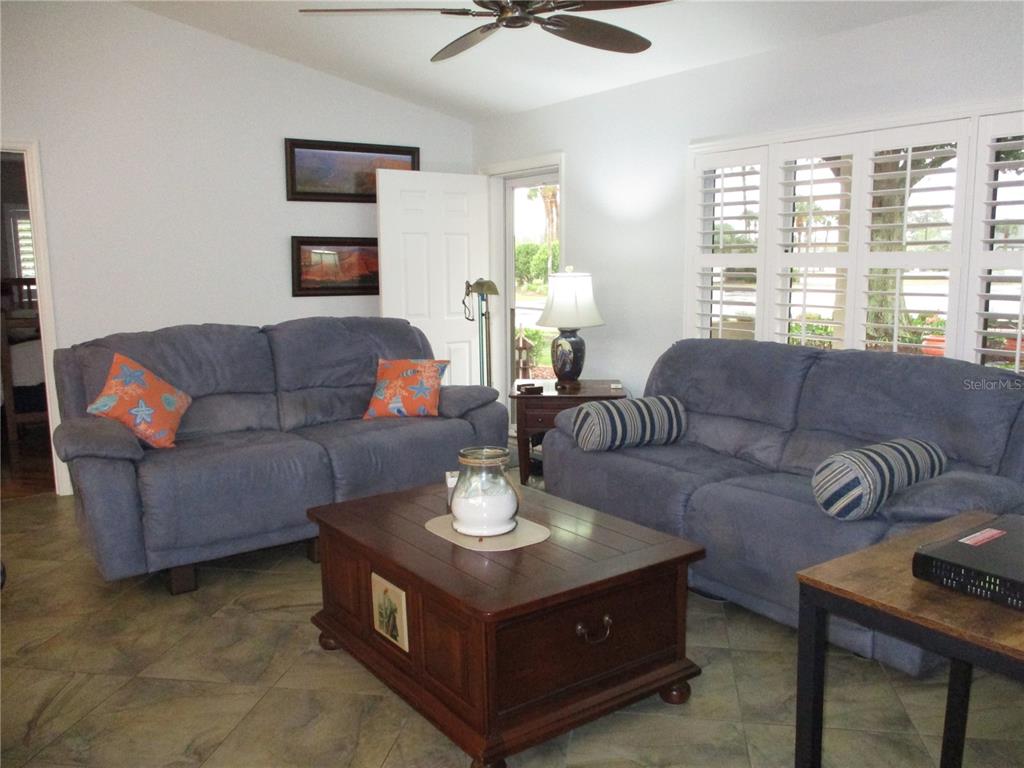 11273 Southwest 136th Place Dunnellon, FL 34432 - Photo 15 of 78 a living room with furniture and a large window